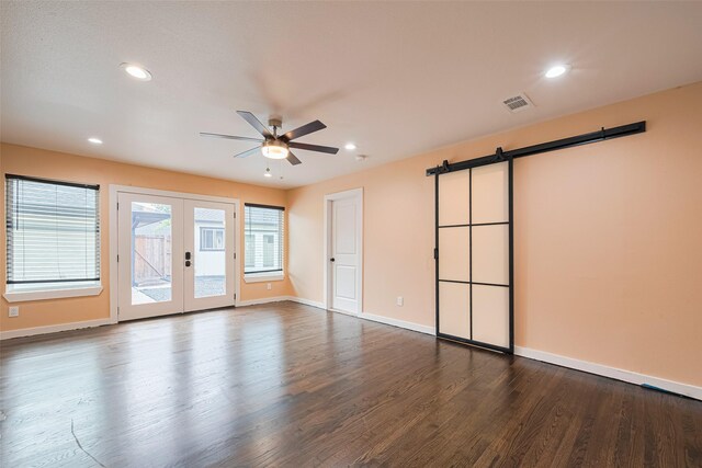 6206 San Felipe St, Houston, TX 77057 - unfurnished room with a barn door, a ceiling fan, french doors, dark wood-type flooring, and recessed lighting