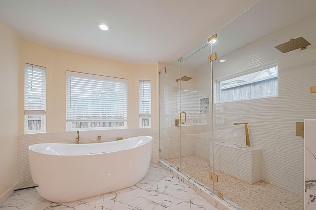 6206 San Felipe St, Houston, TX 77057 - bathroom with a freestanding bath, marble finish floors, a stall shower, and recessed lighting
