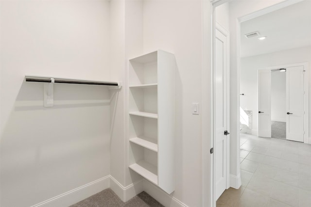 3223 Royal Oaks Hollow Ln, Houston, TX 77082 - spacious closet with tile patterned flooring