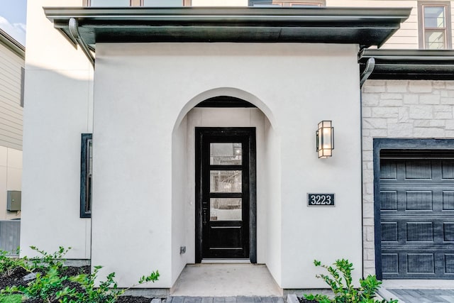 3223 Royal Oaks Hollow Ln, Houston, TX 77082 - property entrance with stucco siding and a garage