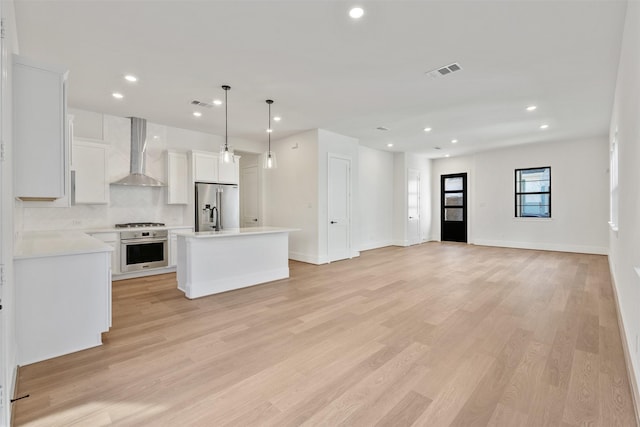 3223 Royal Oaks Hollow Ln, Houston, TX 77082 - unfurnished living room with light wood-type flooring and recessed lighting