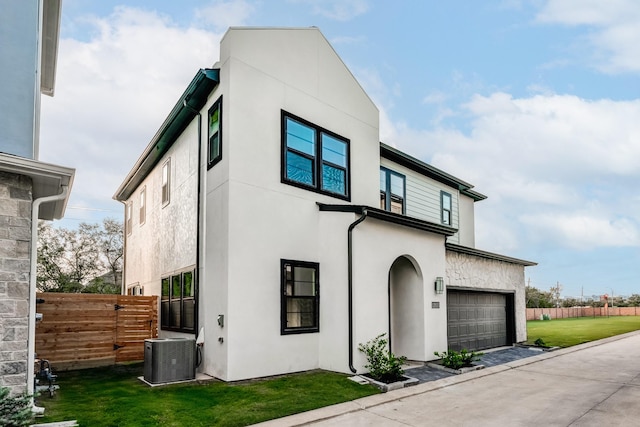 3223 Royal Oaks Hollow Ln, Houston, TX 77082 - view of front of property featuring stucco siding and a garage