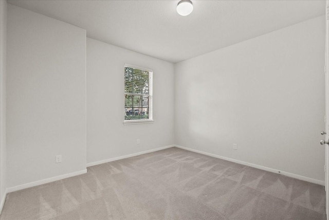 621 Rocky Hollow Ln, League City, TX 77573 - unfurnished room featuring carpet flooring and baseboards