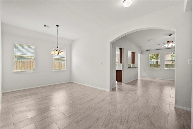621 Rocky Hollow Ln, League City, TX 77573 - empty room with a ceiling fan, arched walkways, and a chandelier
