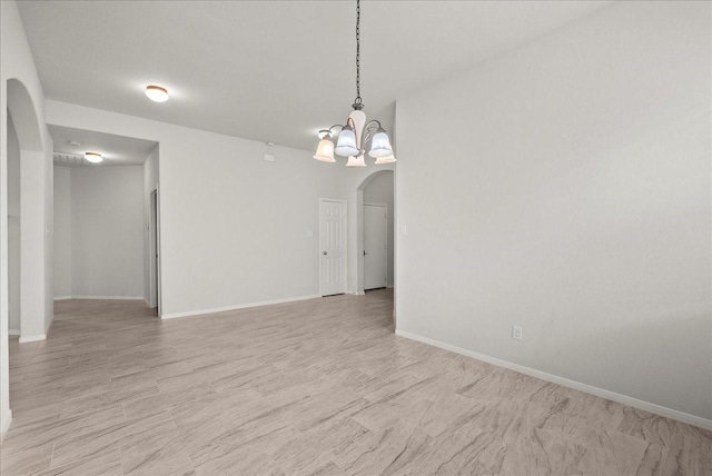 621 Rocky Hollow Ln, League City, TX 77573 - unfurnished room featuring arched walkways and a chandelier