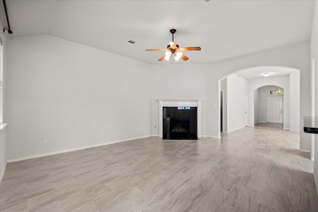 621 Rocky Hollow Ln, League City, TX 77573 - unfurnished living room with a ceiling fan, arched walkways, and a premium fireplace