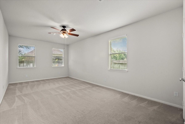 621 Rocky Hollow Ln, League City, TX 77573 - unfurnished room featuring healthy amount of natural light, light colored carpet, and a ceiling fan