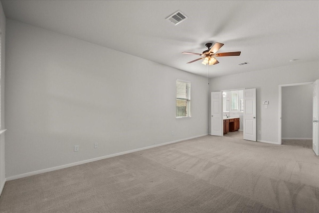 621 Rocky Hollow Ln, League City, TX 77573 - unfurnished bedroom featuring light colored carpet, ensuite bathroom, and ceiling fan