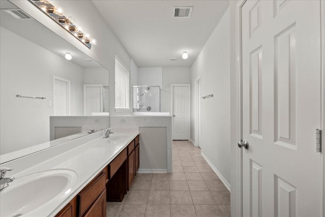 621 Rocky Hollow Ln, League City, TX 77573 - full bathroom with a stall shower, tile patterned floors, and double vanity