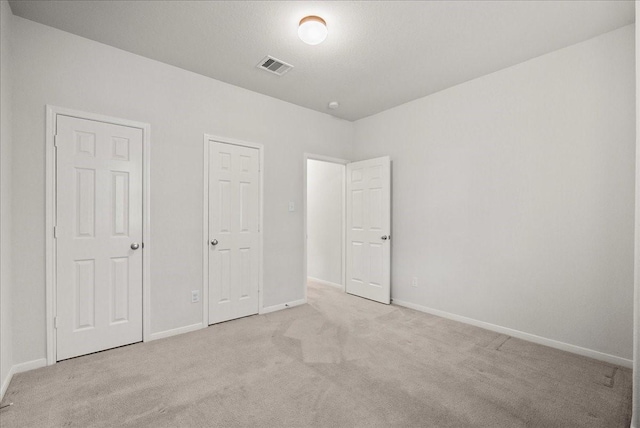621 Rocky Hollow Ln, League City, TX 77573 - unfurnished bedroom with light colored carpet and baseboards