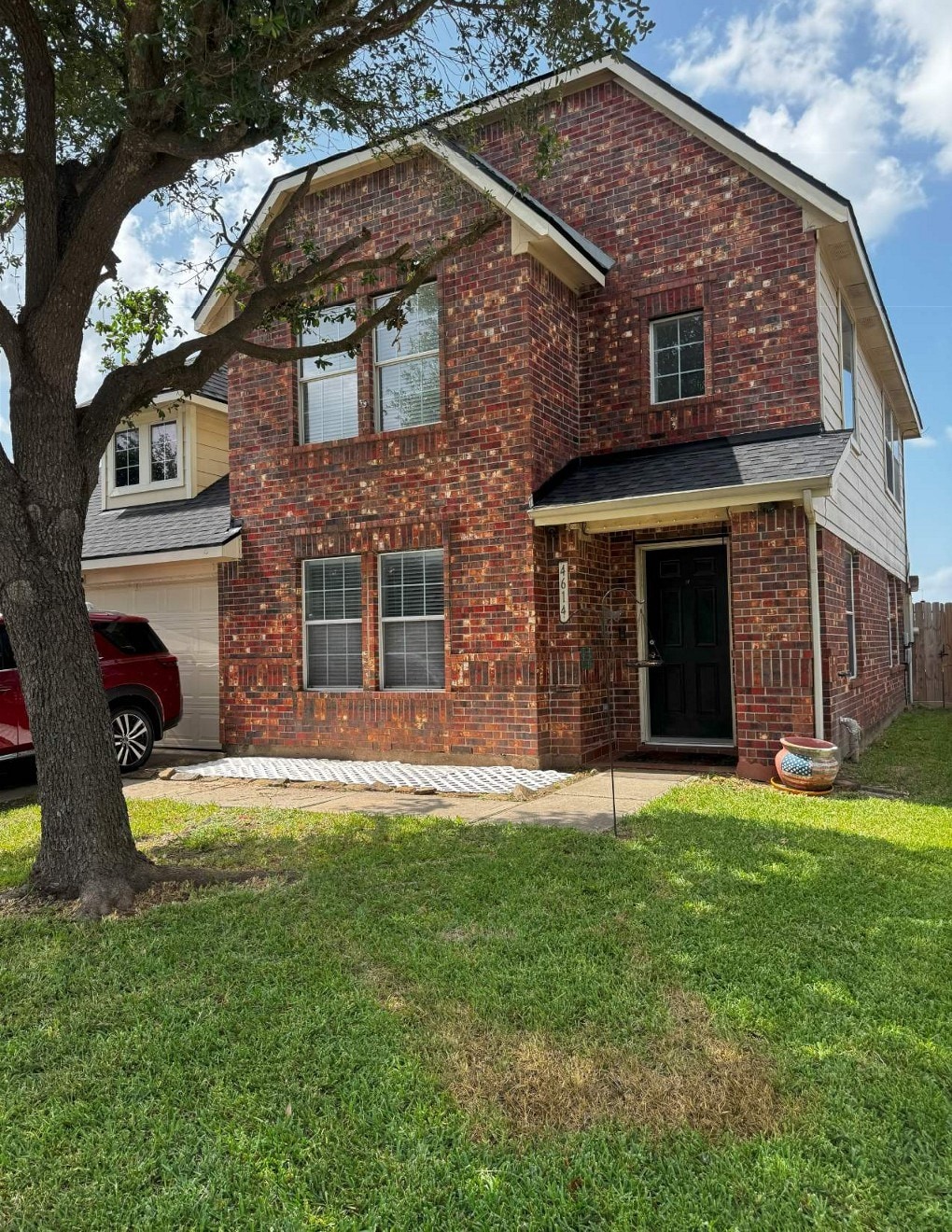 4614 Bridgestone Path Dr, Spring, TX 77388 - traditional-style home featuring brick siding and a front yard