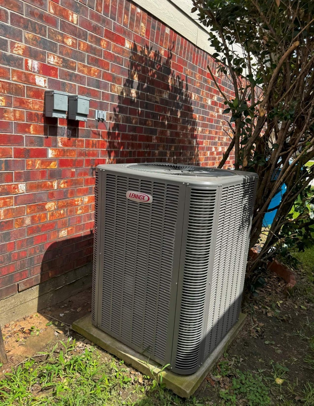 4614 Bridgestone Path Dr, Spring, TX 77388 - exterior view of a central AC unit and brick siding