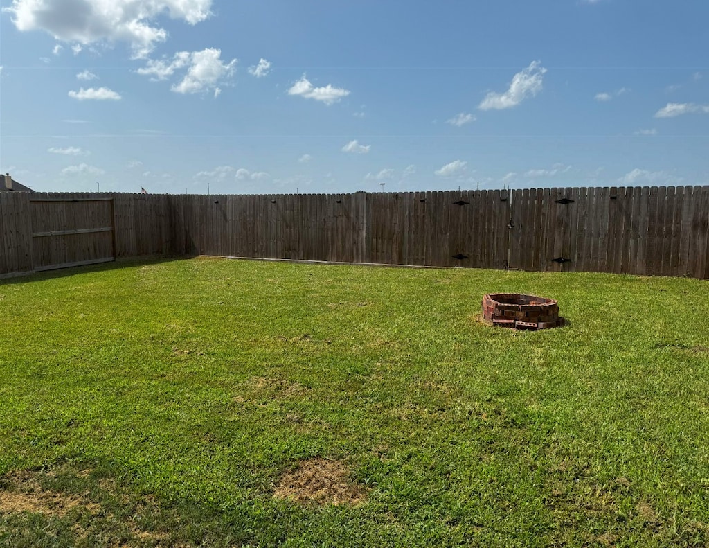 4614 Bridgestone Path Dr, Spring, TX 77388 - fenced backyard with an outdoor fire pit