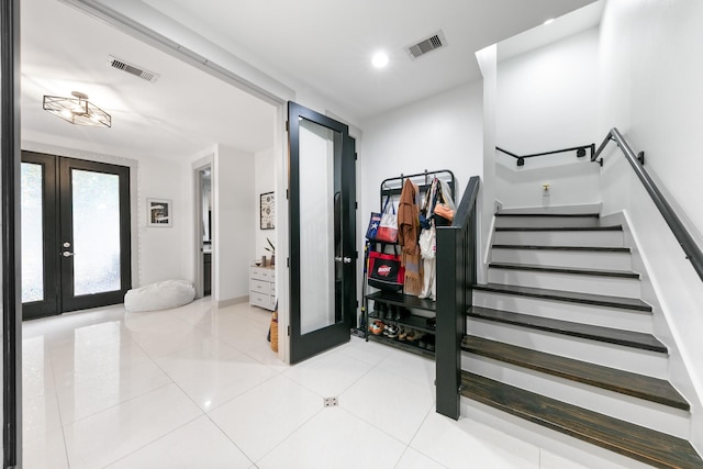 1807 Dart St, Houston, TX 77007 - entryway featuring french doors, stairs, and light tile patterned floors