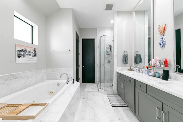 1807 Dart St, Houston, TX 77007 - bathroom featuring a tub with jets, a stall shower, double vanity, and marble finish floors