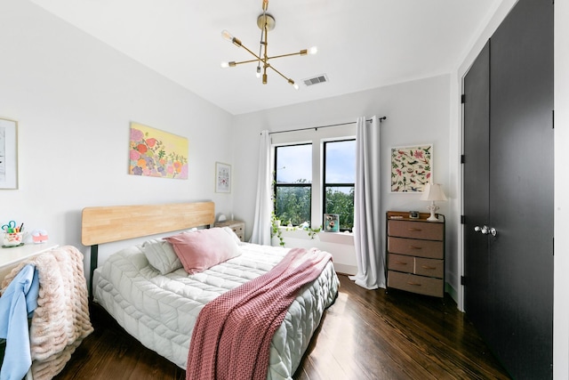 1807 Dart St, Houston, TX 77007 - bedroom featuring dark wood-style floors and a chandelier
