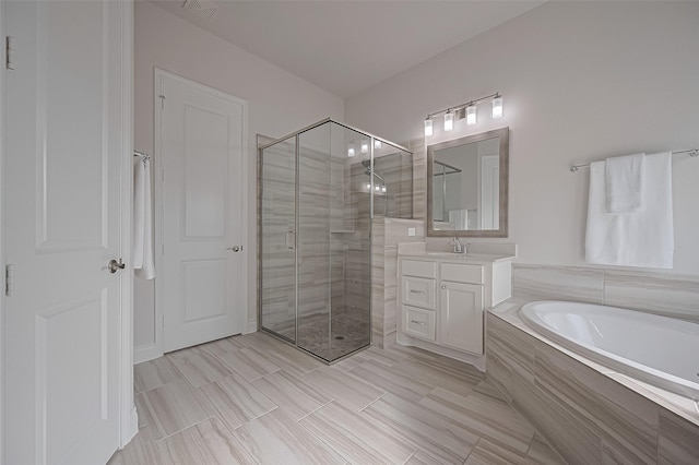 2430 Sunflower Cove Ln, Brookshire, TX 77423 - full bathroom featuring vanity, a stall shower, and a garden tub