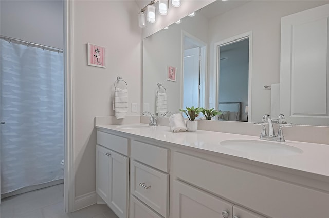 2430 Sunflower Cove Ln, Brookshire, TX 77423 - full bath featuring double vanity and tile patterned floors