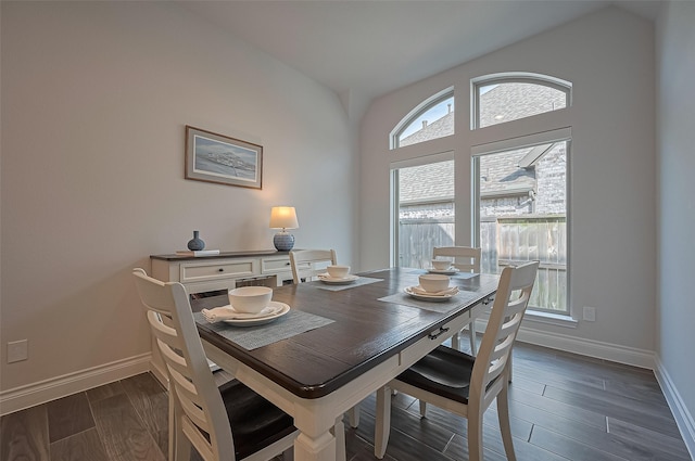 2430 Sunflower Cove Ln, Brookshire, TX 77423 - dining space with dark wood-style floors and vaulted ceiling