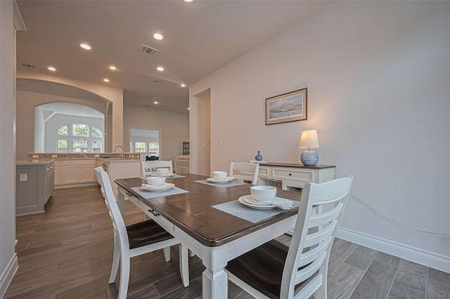 2430 Sunflower Cove Ln, Brookshire, TX 77423 - dining room featuring recessed lighting, light wood finished floors, and arched walkways