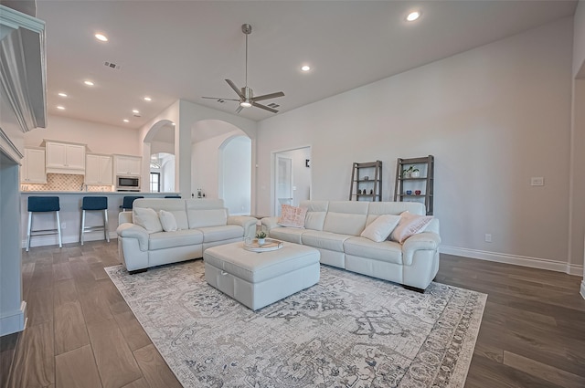 2430 Sunflower Cove Ln, Brookshire, TX 77423 - living room featuring arched walkways, a ceiling fan, dark wood finished floors, and recessed lighting