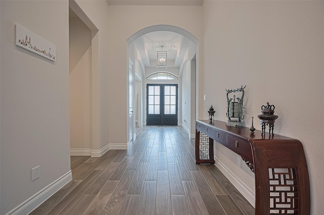 2430 Sunflower Cove Ln, Brookshire, TX 77423 - foyer entrance featuring arched walkways, dark wood-style flooring, and french doors