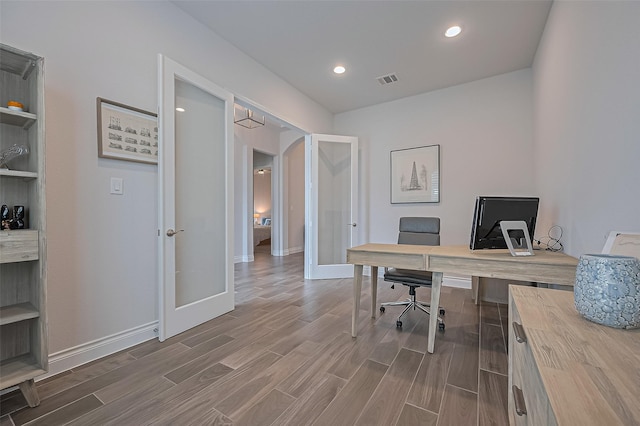 2430 Sunflower Cove Ln, Brookshire, TX 77423 - home office with french doors, wood finished floors, recessed lighting, and arched walkways