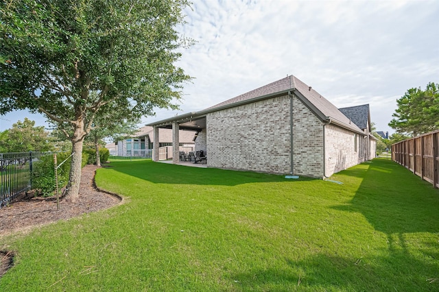 2430 Sunflower Cove Ln, Brookshire, TX 77423 - rear view of house with brick siding and a patio