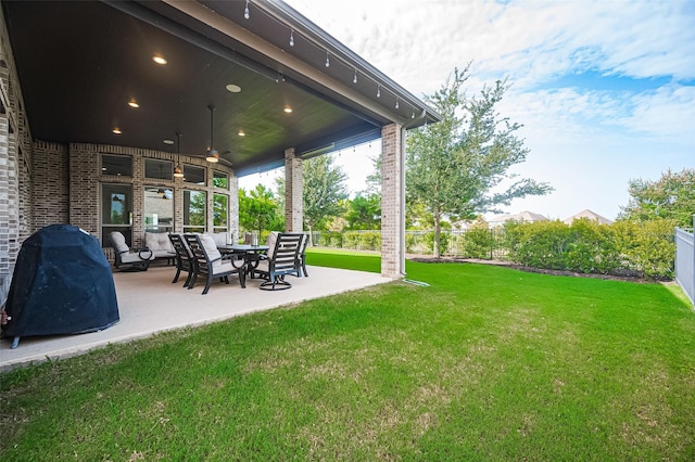 2430 Sunflower Cove Ln, Brookshire, TX 77423 - fenced backyard featuring ceiling fan and a patio area