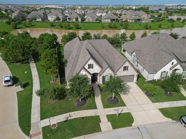 2430 Sunflower Cove Ln, Brookshire, TX 77423 - aerial view of residential area featuring a nearby body of water