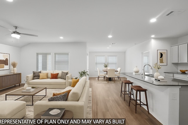 27219 Tulum Cv, Katy, TX 77493 - living area with wood finished floors, recessed lighting, and ceiling fan