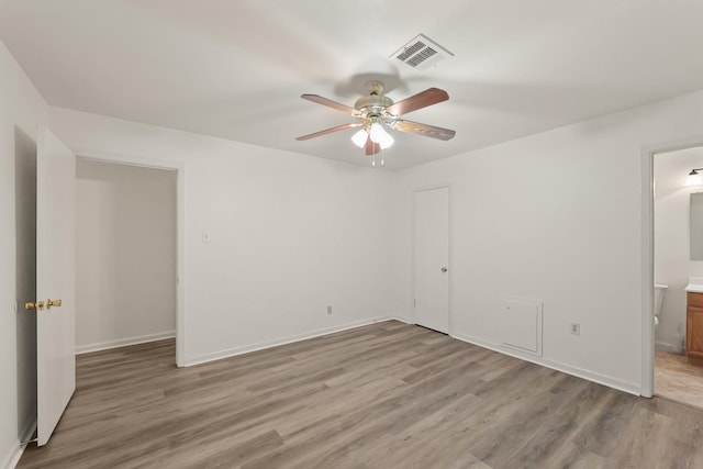 746 Fawn Dr, Houston, TX 77015 - unfurnished bedroom with light wood-style flooring, ensuite bath, and a ceiling fan