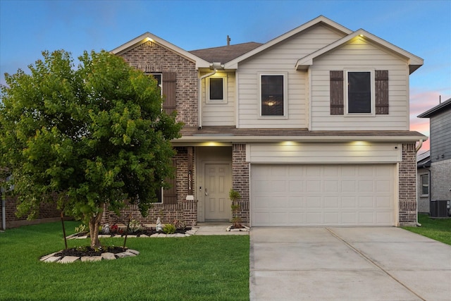 1516 Foshee Ct, Alvin, TX 77511 - view of front of home with brick siding, driveway, an attached garage, and a yard