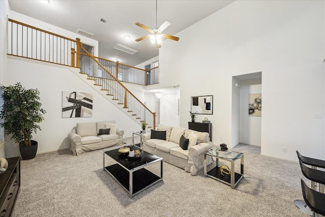 1516 Foshee Ct, Alvin, TX 77511 - carpeted living area with stairway, a ceiling fan, and a towering ceiling