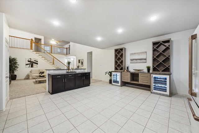 1516 Foshee Ct, Alvin, TX 77511 - indoor dry bar featuring wine cooler, stairs, light tile patterned floors, and recessed lighting