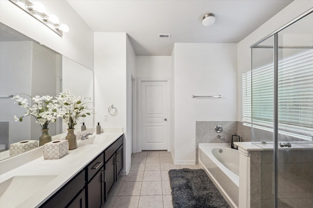 1516 Foshee Ct, Alvin, TX 77511 - full bath featuring double vanity, a bath, and tile patterned flooring