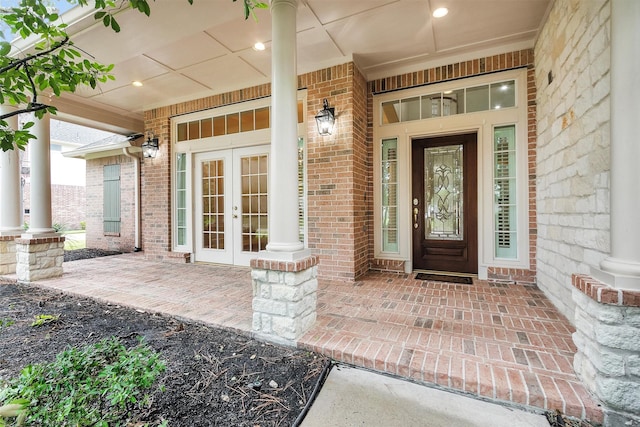 14015 Halprin Creek Dr, Cypress, TX 77429 - property entrance featuring french doors, brick siding, and covered porch