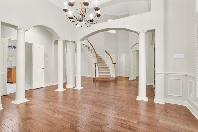 14015 Halprin Creek Dr, Cypress, TX 77429 - foyer with a towering ceiling, light wood-style floors, a chandelier, and stairway