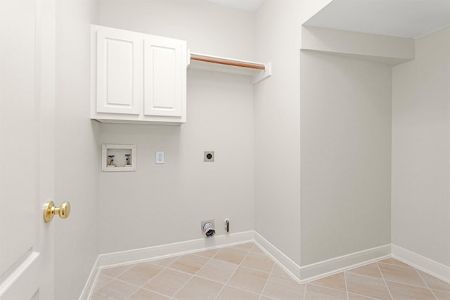 14015 Halprin Creek Dr, Cypress, TX 77429 - washroom featuring hookup for an electric dryer, hookup for a washing machine, cabinet space, and light tile patterned flooring