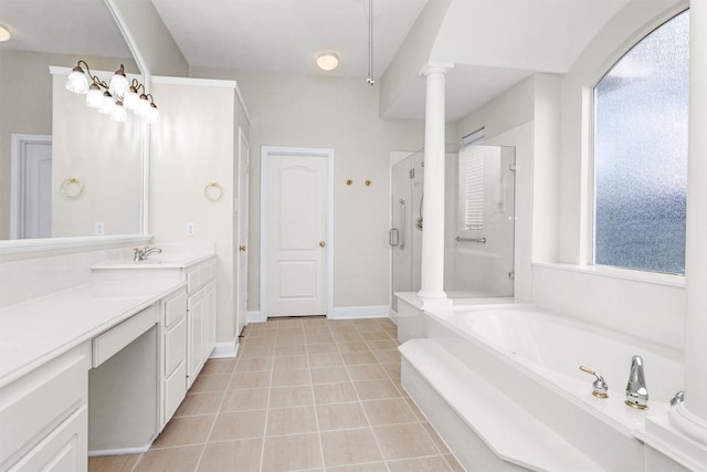 14015 Halprin Creek Dr, Cypress, TX 77429 - bathroom featuring ornate columns, a garden tub, healthy amount of natural light, and a shower stall