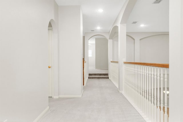 14015 Halprin Creek Dr, Cypress, TX 77429 - corridor with light carpet, arched walkways, and recessed lighting