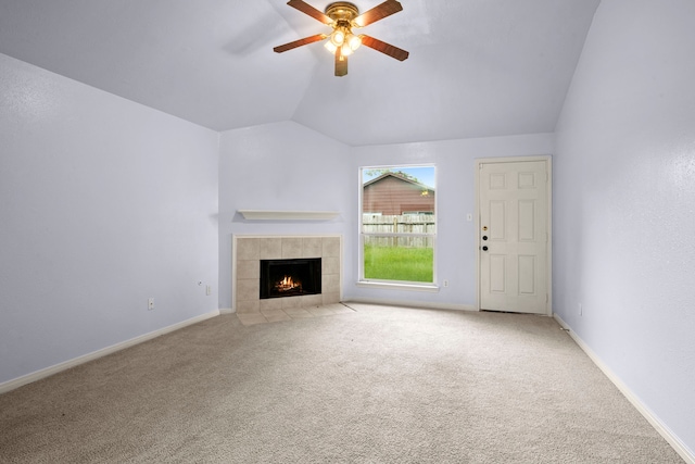 15819 Nutcracker Ct, Humble, TX 77396 - unfurnished living room with a ceiling fan, carpet, vaulted ceiling, and a fireplace