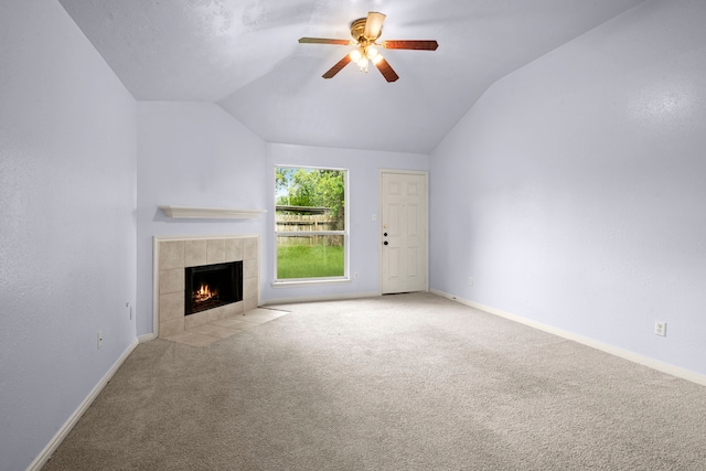 15819 Nutcracker Ct, Humble, TX 77396 - unfurnished living room with vaulted ceiling, a fireplace, a ceiling fan, and carpet flooring