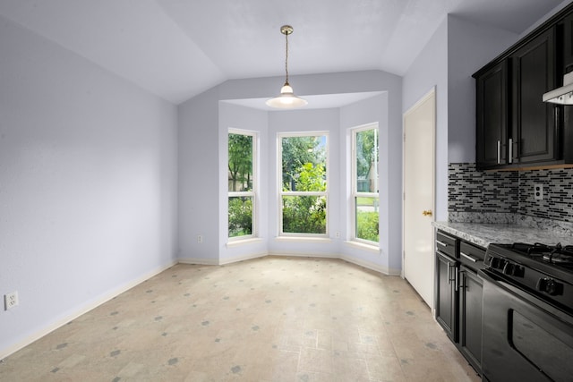 15819 Nutcracker Ct, Humble, TX 77396 - kitchen with range with gas stovetop, dark cabinets, decorative backsplash, lofted ceiling, and decorative light fixtures