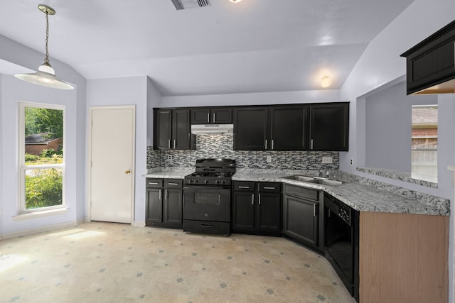 15819 Nutcracker Ct, Humble, TX 77396 - kitchen featuring black appliances, under cabinet range hood, lofted ceiling, backsplash, and hanging light fixtures