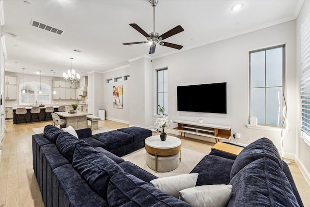 846 Dunleigh Meadows Ln, Houston, TX 77055 - living area featuring light wood-style floors, a chandelier, ceiling fan, ornamental molding, and recessed lighting