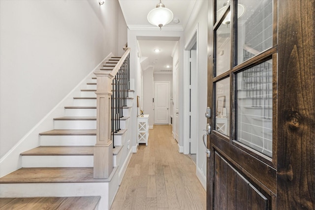 846 Dunleigh Meadows Ln, Houston, TX 77055 - entrance foyer with crown molding, stairs, and light wood finished floors