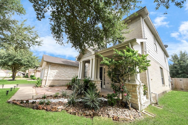 7619 Park Sage Ln, Cypress, TX 77433 - view of side of home with brick siding and a yard