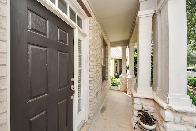 7619 Park Sage Ln, Cypress, TX 77433 - view of exterior entry with a porch and brick siding