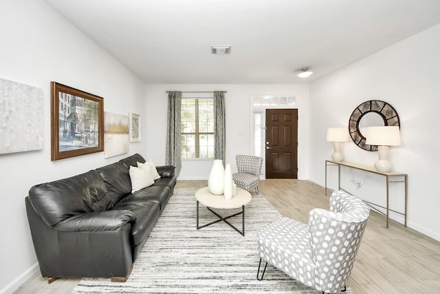 7619 Park Sage Ln, Cypress, TX 77433 - living area featuring light wood-type flooring and baseboards